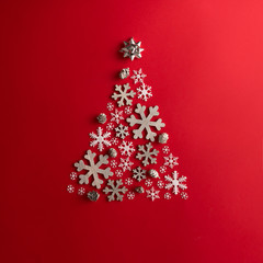 Fototapeta na wymiar Christmas and New Years red background with Christmas Tree made