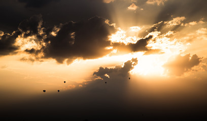 Hot air balloons flying in sunset