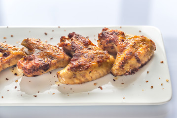 Fried chicken wings on the white plate