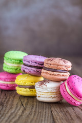 Colorful macarons on the wooden background