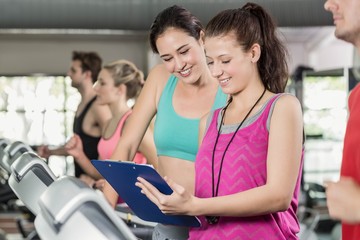 Female trainer discussing about performance