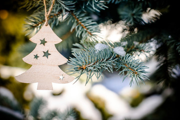 Christmas background with fir-tree wooden closeup 