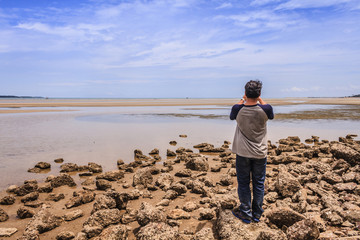 Man On Seashore / Rayong, Thailand - August 06, 2016: Unidentified A Man On Seashore At Cloudscape Background.
