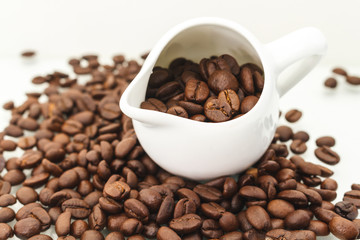 Roasted Coffee Beans / Roasted Coffee Beans In Cup Scattered Isolated On White.