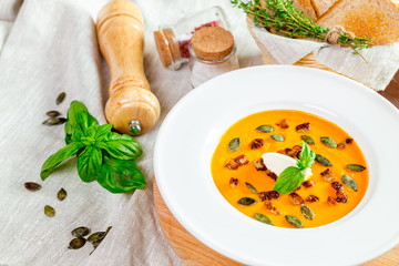 Pumpkin soup in white plate