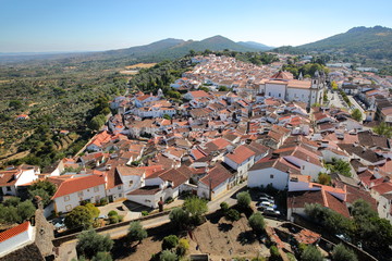 Fototapeta na wymiar CASTELO DE VIDE, PORTUGAL: View of the Old Town with whitewashed houses and tiled roofs from the medieval castle