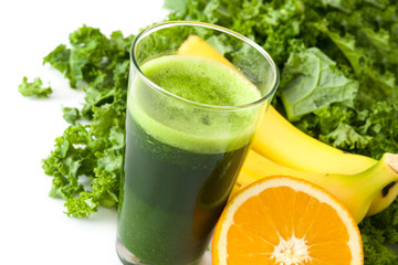 Smoothie with kale,banana and orange isolated on white background
