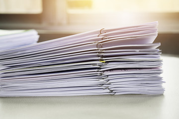 Pile of unfinished documents on office desk, Stack of business p