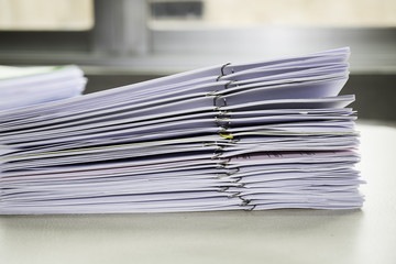 Pile of unfinished documents on office desk, Stack of business p