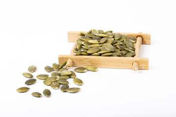 Pumpkin seeds on a white background.