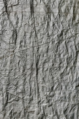 Obraz premium Wrinkled plastic tarpaulin covering, Yangon, Myanmar
