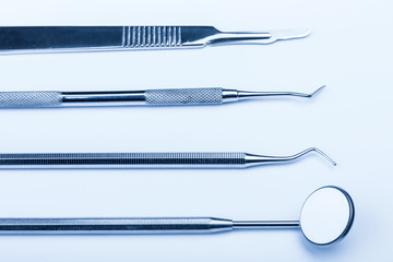 Dentist's medical equipment tools on white background