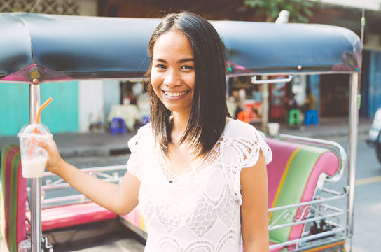 Thai woman with tuk tuk taxi