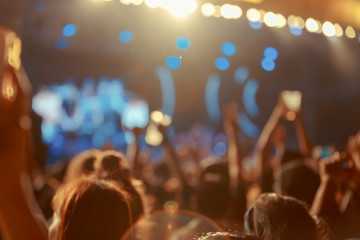 Crownd  in front of concert stage blurred