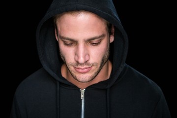 Handsome man wearing a black hoodie