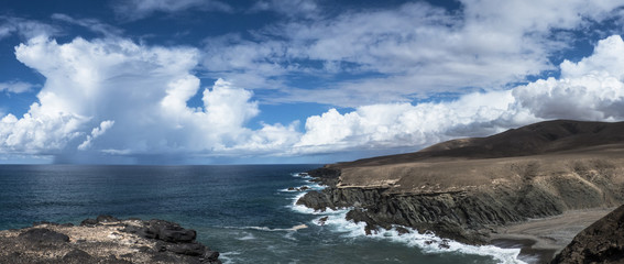 Atlantic steep coast on the Canary Islands with a bay.