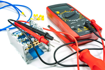 Tools and equipment for electrical work on a white background