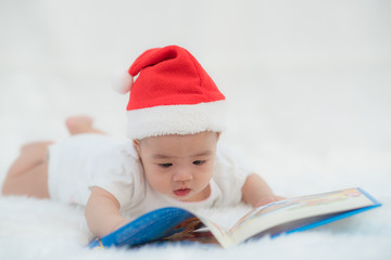 Baby reading a book