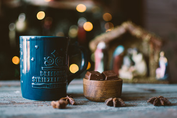 cup of coffee and chocolate with christmas background