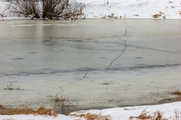 A dangerous crack in the ice, the entire width of the river.