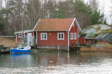 fishermans boathouse and boat with pier