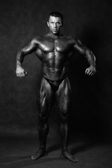 Fototapeta na wymiar Muscular male Bodybuilder posing