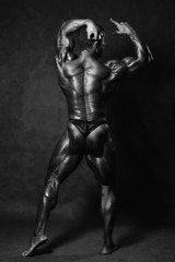 Fototapeta na wymiar Beautiful muscular man's back in the studio