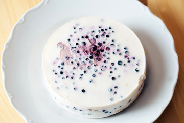 Delicious creamy cake with blueberries