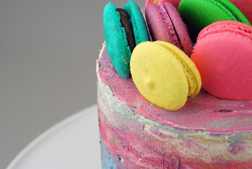 Vanilla Ombre Cake with water colour, buttercream topping with macaroons