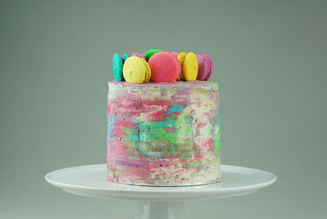 Vanilla Ombre Cake with water colour, buttercream topping with macaroons © wanfahmy