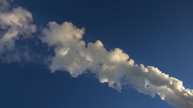 smoke and vapor across blue sky time lapse
