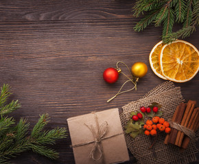 Christmas tree with gift box and decorations on wooden backgroun