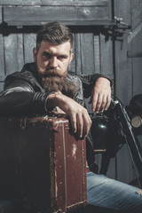 Obraz na płótnie Canvas Bearded man hipster biker