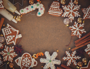 christmas frame with gingerbread baked cookies and spices on cooking paper, retro toned