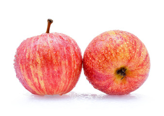 gala apples with drops of water on white background