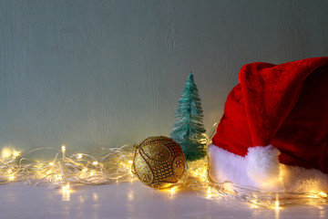 christmas gold ball decoration with garland warm lights