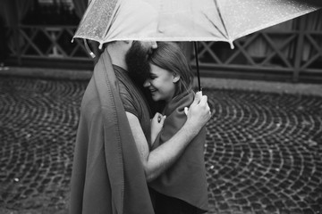 guy and girl under an umbrella