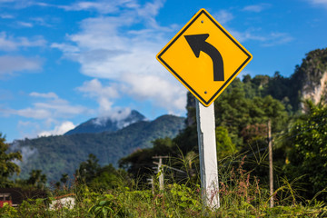 The Road sign left curve in Thailand