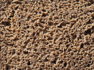 Rye black bread texture detail, whole grain bread background