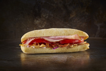 BBQ ciabatta. Dark metal background. Space.