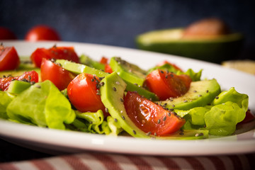 Avocado salad with cherry tomatoes and chia seeds