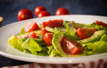 Avocado salad with cherry tomatoes and chia seeds
