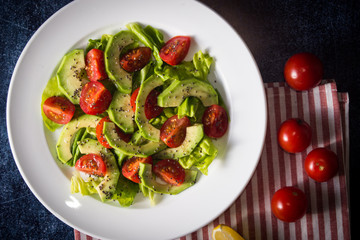 Avocado salad with cherry tomatoes and chia seeds