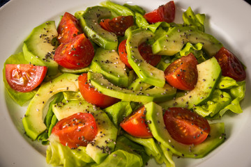 Avocado salad with cherry tomatoes and chia seeds