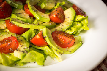 Avocado salad with cherry tomatoes and chia seeds