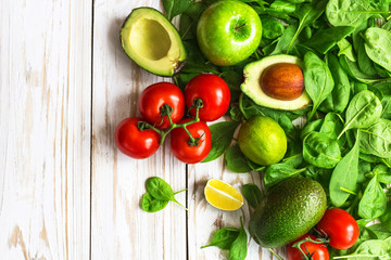 Spinach, lime, avocado, cherry tomatoes,  and apple
