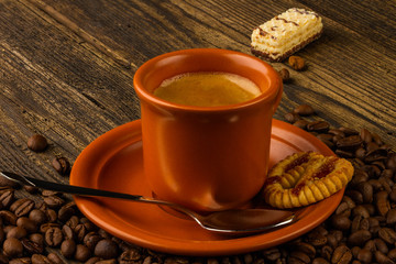 cup of coffee, sweet and coffee beans