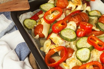 Baked chicken breast with cheese, mustard and vegetables. Food from the oven. Finished diet food.
