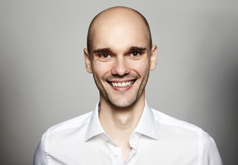 Obraz premium Smiling Man in White Shirt