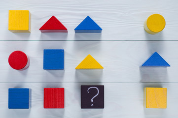 IQ test. Choose correct answer. Logical tasks composed of geometric wooden shapes. Children's...